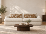 Monterey sofa with ivory upholstery and patterned pillows in an AI-generated living room
