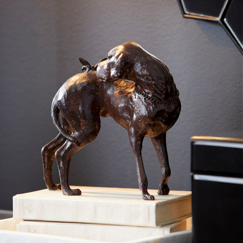 Rubbed Red Dog and Butterfly Sculpture