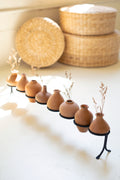Eight Clay Vessels on An Iron Base