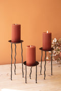 Set of Three Rustic Metal Candle Stands with Wavy Legs
